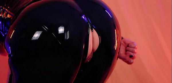  sexy curvy MILF Arya Grander fetish model posing in latex rubber catsuit